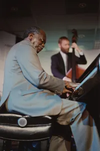 Mixed Race Group Prints: Hank Jones, Jazz Inn Party, Nordwijk, Netherlands, 1989. Creator: Brian Foskett