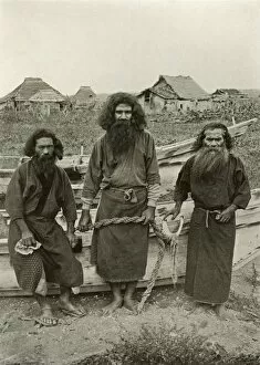 Villager Gallery: Happu Konno, The Hunter (In Centre) and Two Ainu Fishermen, 1910. Creator: Herbert Ponting