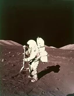 Sample Collection: Harrison Schmitt collects lunar rake samples, Apollo 17 mission, December 1972. Creator: NASA