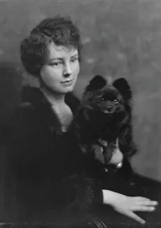 Faraway Look Prints: Hartshorne, Miss, with dog, portrait photograph, 1917 May 15. Creator: Arnold Genthe
