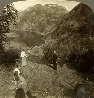 Underwood Travel Library Gallery: Haying on mountain shelf high above Marok village and mirror-clear Geirangerfjord