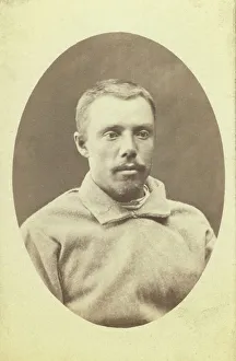 Head-and-shoulders portrait of a man, dressed in convict clothing, facing... between 1880 and 1886. Creator: Unknown