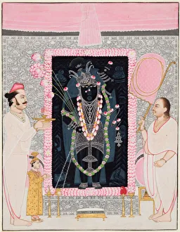 The head priest (Tilakayat) Govardhanlalji makes offerings to Shri Nathji in celebration