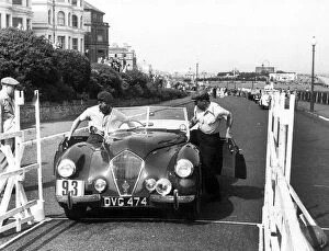 Healey Westland 2.4, Eastbourne Rally 1952, S.P.A. Freeman getting into car. Creator: Unknown