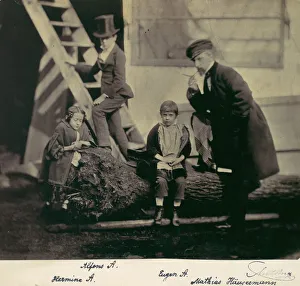 [Hermine, Alfons and Eugen Antoine and Mathias Housermann on a fallen tree]