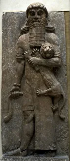 Hero Gilgamesh mastering a lion, 722-705 BC. Artist: Assyrian Art Hero Gilgamesh mastering a lion, 722-705 BC. Artist: Assyrian Art