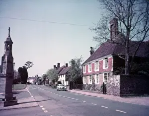 Cottages Prints: High Street and war memorial, Burwash, Sussex, c1955. Creator: Arthur Charles Kirby Ware