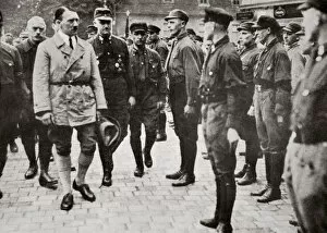 Standing To Attention Gallery: Hitler inspecting a group of SA Members during World War II, Germany, 1939-1945. Artist