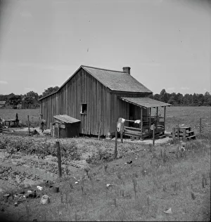 Homestead Prints: Home of turpentine workers near Godwinsville, Georgia, 1937. Creator: Dorothea Lange