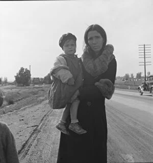 Displaced Person Gallery: Homeless mother and youngest child of seven...on U.S. 99, near Brawley, Imperial County, 1939