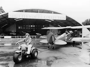 Bedfordshire Prints: A Honda all terrain cycle pulling a vintage biplane, 1982