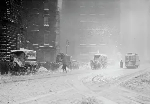 Tyre Track Prints: Horse-drawn wagons on snowy street, NY snow storm, 1910. Creator: Bain News Service