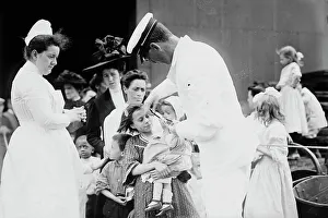 Hospital boat, a mother, her child, and a doctor, upper deck, 1910. Creator: Bain News Service