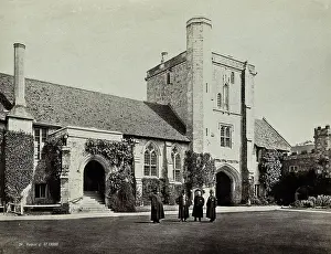 Alms Prints: Hospital of Saint Cross, Winchester: four men standing in the courtyard