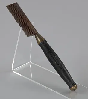 Hot comb from a travel hair care kit used by Anna Mae Queen Holmes, mid 20th century Hot comb from a travel hair care kit used by Anna Mae Queen Holmes, mid 20th century