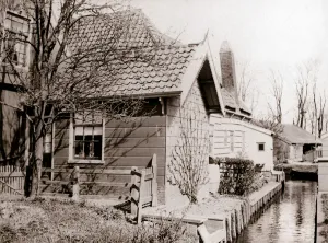 House on a canal bank, Broek, Netherlands, 1898. Artist: James Batkin