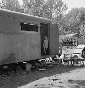 Caravan Gallery: The house trailer and the youngest little girl, Washington, Yakima Valley, Toppenish, 1939