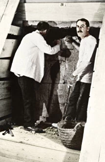 Archaeologist Gallery: Howard Carter and a colleague excavating a tomb in the Valley of the Kings, Egypt, 1922