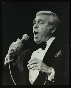 Howard Keel singing at the Forum Theatre, Hatfield, Hertfordshire, 14 May 1983. Artist