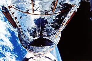 Optics Prints: The Hubble Space Telescope orbiting the Earth, c1990s