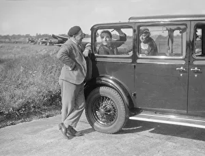 Hugh McConnell, Sammy Davis and Mrs Davis with an Austin 20 / 6 landaulette at Brooklands, 1931