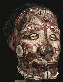 Human skull with features modelled in clay and painted, from New Guinea Human skull with features modelled in clay and painted, from New Guinea