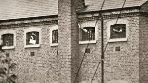 Campaigner Gallery: Hunger strikers waving to Christabel Pankhurst from their cells in Holloway Prison, London, 1909