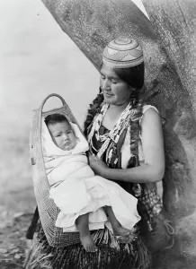 Hupa Prints: Hupa mother, three-quarter length portrait