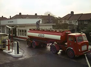 Garage Prints: Ilford Esso petrol station with Leyland tanker making delivery 1964. Creator: Unknown