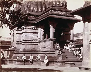 Mumbai Maharashtra India Prints: Indian men sitting on steps outside a domed building in Bombay during an outbreak of plague