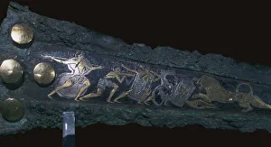 Detail of inlay on a Mycenaean bronze dagger showing a lion hunt, 16th century Detail of inlay on a Mycenaean bronze dagger showing a lion hunt, 16th century