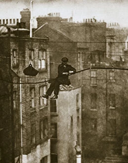 Inspecting a telephone cable between Conduit and Maddox Streets, 20th century. Artist