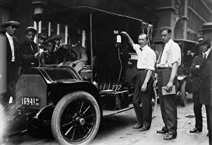 Inspecting Prints: Inspector Walsh condemning taxicab, 1913. Creator: Bain News Service