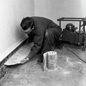 Installing a damp proof course in a house in Goldthorpe, South Yorkshire, 1957. Artist