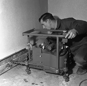 Barnsley Gallery: Installing a damp proof course in a house in Goldthorpe, South Yorkshire, 1957. Artist
