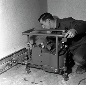 Barnsley Gallery: Installing a damp proof course in a house in Goldthorpe, South Yorkshire, 1957. Artist