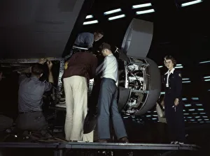 Aeronautics Gallery: Installing an engine at the Consolidated Aircraft Corporation plant, Fort Worth, Texas, 1942