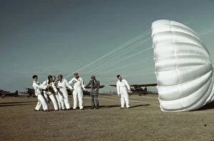 Cloth Collection: Instructor explaining the operation of a parachute to student pilots, Fort Worth, Tex. 1942