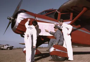 Propellers Prints: Instructor and students studying a map