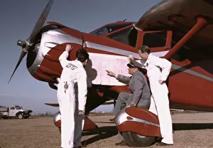 Airport Gallery: Instructor and students studying a map, Meacham Field, Fort Worth, Tex. 1942