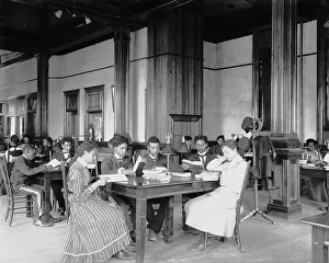 Segregated Prints: Interior view of library reading room with male and female students