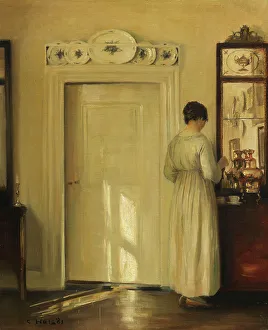 Country Estate Prints: Interior with woman making tea, c1900-1910. Creator: Holsøe; Carl (1863-1935)