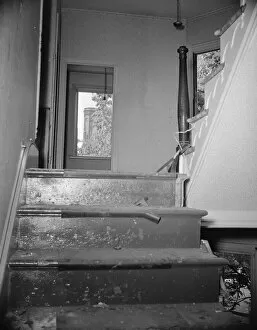 Staircase Gallery: Interior of wrecked houses on Independence Avenue, Washington, D.C, 1942. Creator: Gordon Parks