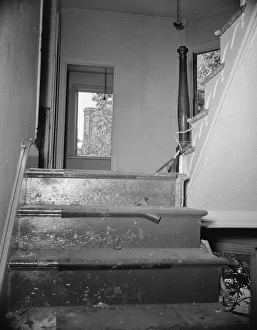 Staircase Gallery: Interior of wrecked houses on Independence Avenue, Washington, D.C, 1942. Creator: Gordon Parks