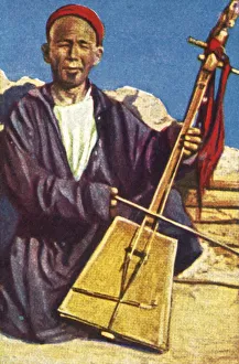 Itinerant musician, Mongolia, c1928. Creator: Unknown