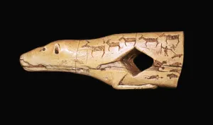 Ivory arrow straightener in the form of a bear with engraved pictographs