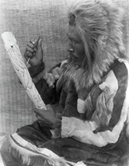 The ivory carver-Nunivak, c1929. Creator: Edward Sheriff Curtis