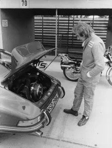 Hands In Pockets Prints: James Hunt with a Porsche, c1972-c1973