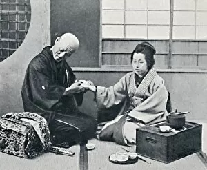 A Japanese doctor and patient, 1902. Artist: Kajima & Suwo