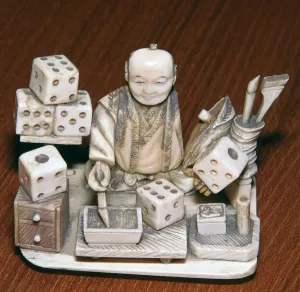 Dice Prints: Japanese ivory of a dice painter, 19th century